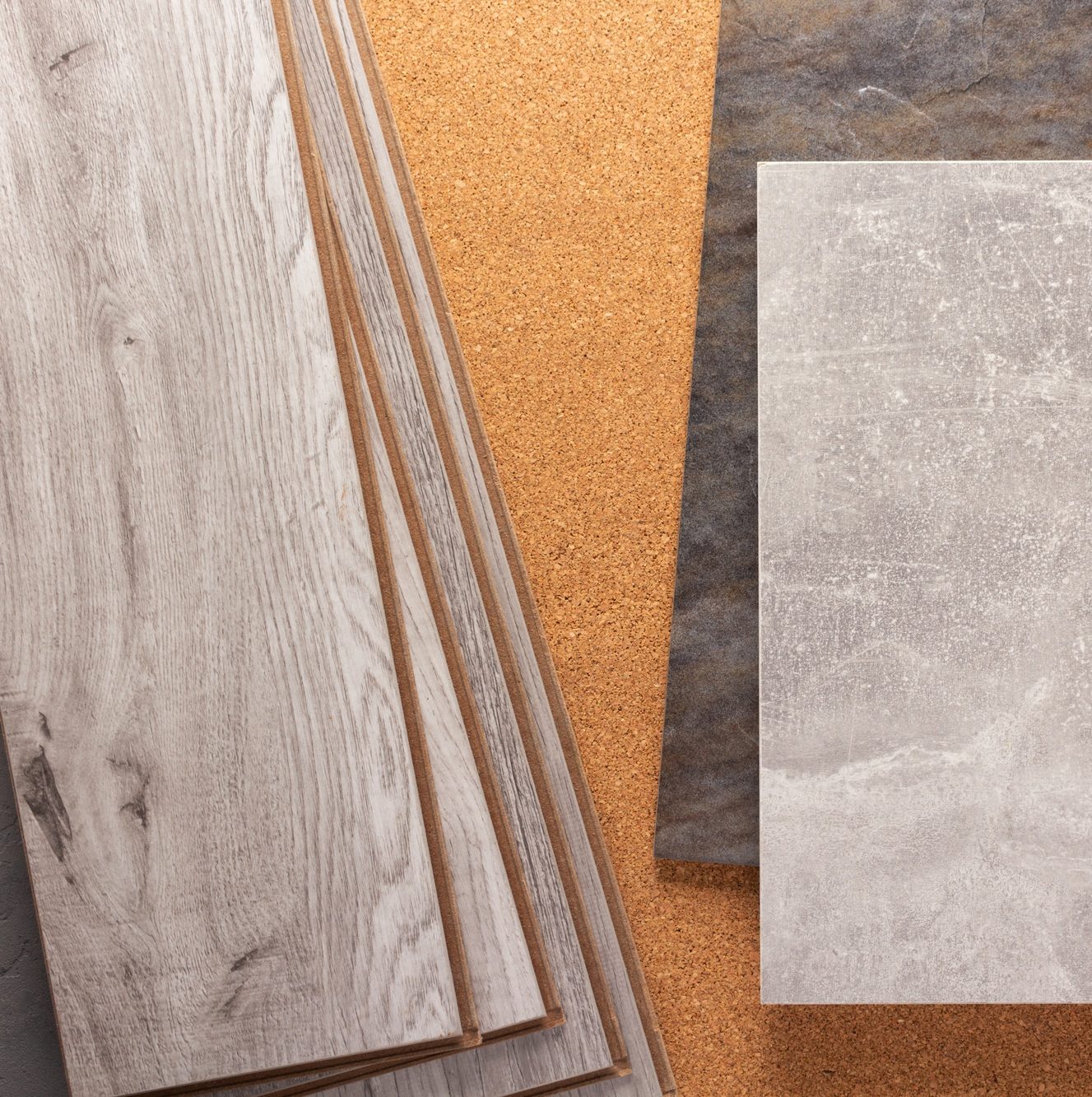 Wood laminate and tile background at floor texture. Flooring heap